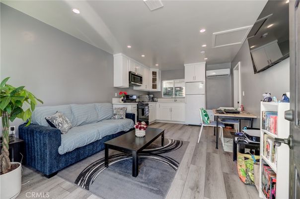 Dining room, Interior, Kitchen, Living room, Recessed Lighting, Stainless Steel Appliances, Wood Texture Flooring