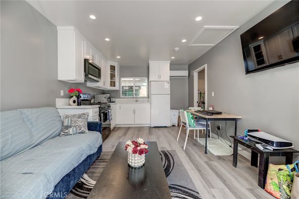 Dining room, Interior, Kitchen, Living room, Recessed Lighting, Stainless Steel Appliances, Wood Texture Flooring