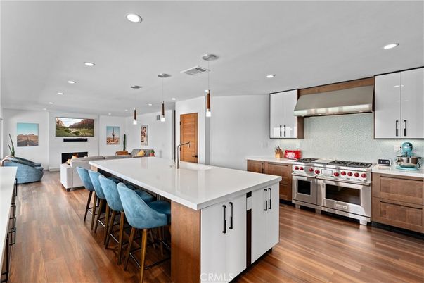 Fireplace, Interior, Kitchen, Living room, Pendant Lights, Recessed Lighting, Stainless Steel Appliances, Wood Texture Flooring