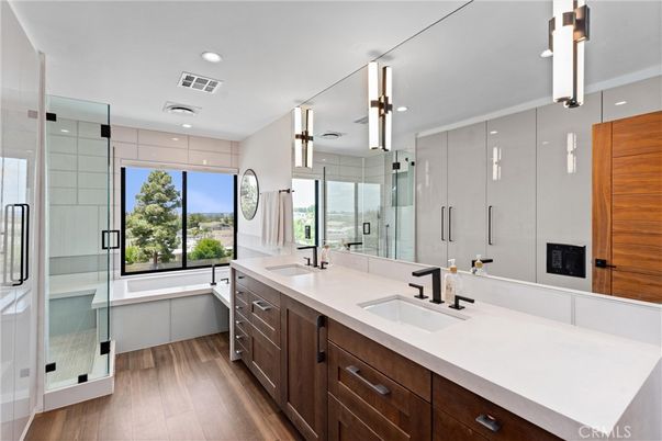 Bathroom, Dual Sink Vanities, Glass Shower, Interior, Recessed Lighting, Wood Texture Flooring