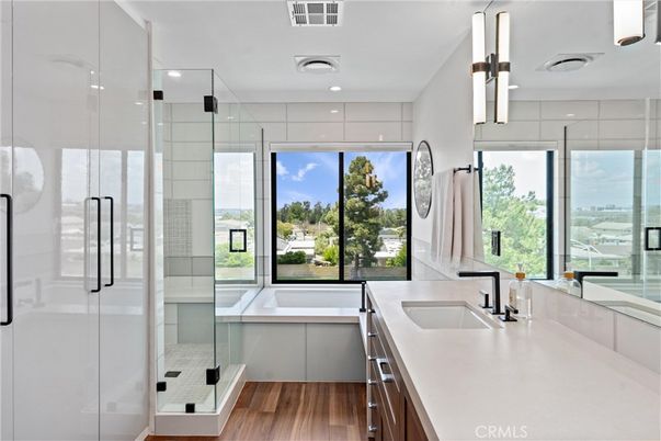 Bathroom, Dual Sink Vanities, Glass Shower, Interior, Pendant Lights, Recessed Lighting, Wood Texture Flooring
