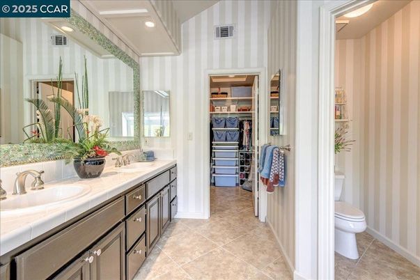 Bathroom, Dual Sink Vanities, Interior, Recessed Lighting, Tile Countertops, Walk-in Closets