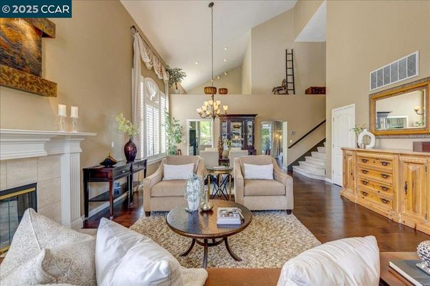 Chandelier, Dining room, Fireplace, Interior, Living room, Recessed Lighting, Wood Texture Flooring