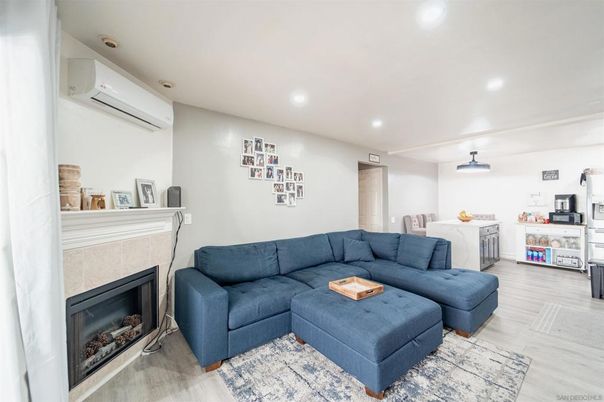 Dining room, Fireplace, Interior, Living room, Recessed Lighting, Wood Texture Flooring