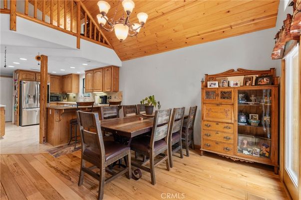 Chandelier, Dining room, Interior, Kitchen, Recessed Lighting, Stainless Steel Appliances, Wooden Ceilings, Wood Texture Flooring
