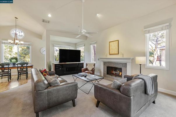 Dining room, Fireplace, Interior, Living room, Pendant Lights, Recessed Lighting, Wood Texture Flooring