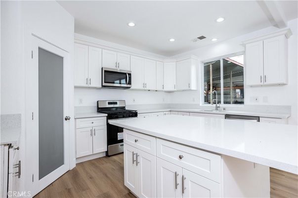 Interior, Kitchen, Recessed Lighting, Stainless Steel Appliances, Wood Texture Flooring
