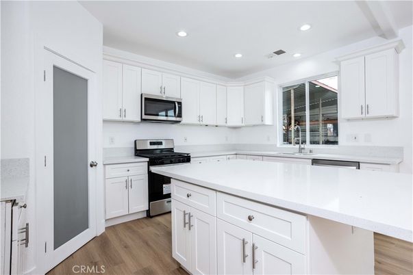 Interior, Kitchen, Recessed Lighting, Stainless Steel Appliances, Wood Texture Flooring