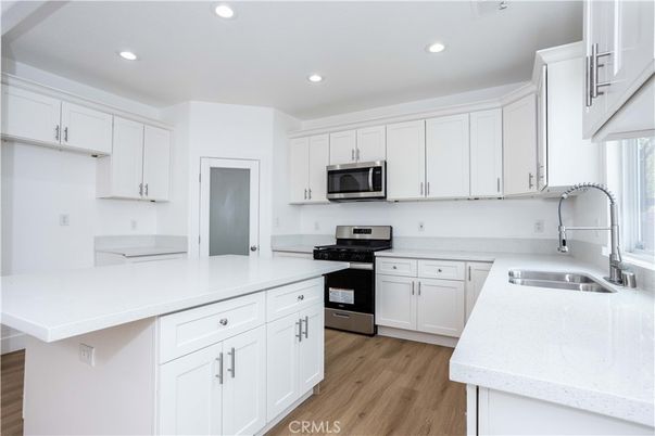 Interior, Kitchen, Recessed Lighting, Stainless Steel Appliances, Wood Texture Flooring