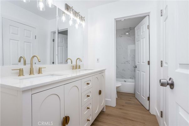 Bathroom, Dual Sink Vanities, Interior, Marble Walls, Wood Texture Flooring