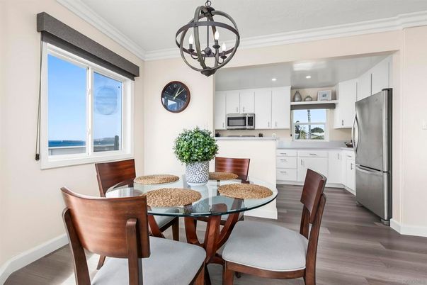 Chandelier, Dining room, Interior, Kitchen, Pendant Lights, Recessed Lighting, Stainless Steel Appliances, Wood Texture Flooring