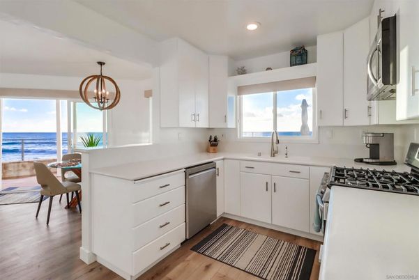 Dining room, Interior, Kitchen, Pendant Lights, Recessed Lighting, Stainless Steel Appliances, Water, Wood Texture Flooring
