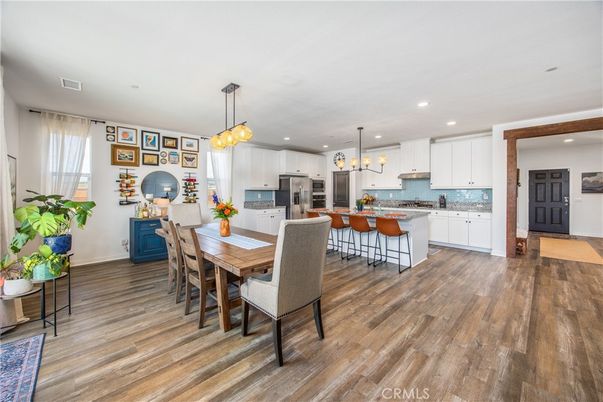 Dining room, Interior, Kitchen, Pendant Lights, Recessed Lighting, Stainless Steel Appliances, Wood Texture Flooring