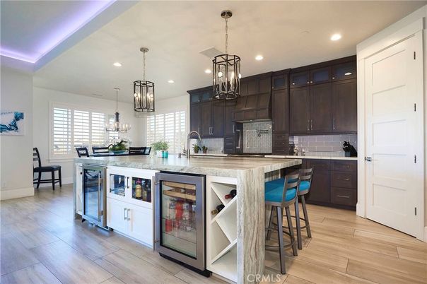 Chandelier, Dining room, Interior, Kitchen, Pendant Lights, Recessed Lighting, Stainless Steel Appliances, Wood Texture Flooring