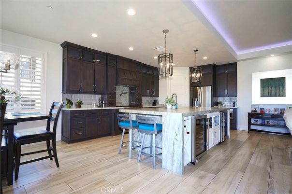 Dining room, Interior, Kitchen, Pendant Lights, Recessed Lighting, Stainless Steel Appliances, Wood Texture Flooring