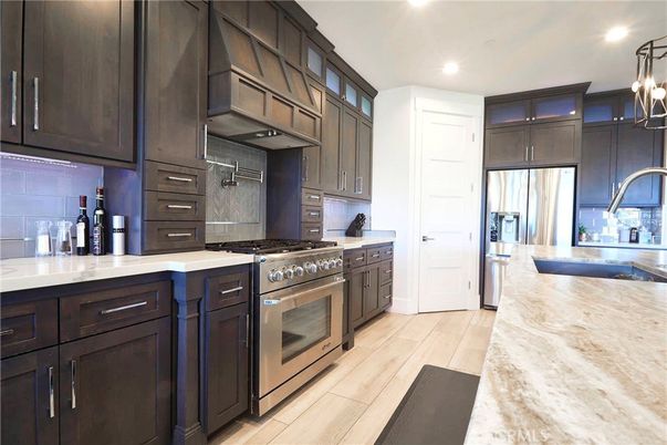 Chandelier, Interior, Kitchen, Recessed Lighting, Stainless Steel Appliances, Wood Texture Flooring