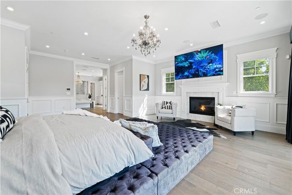 Bedroom, Chandelier, Fireplace, Interior, Pendant Lights, Recessed Lighting, Wood Texture Flooring