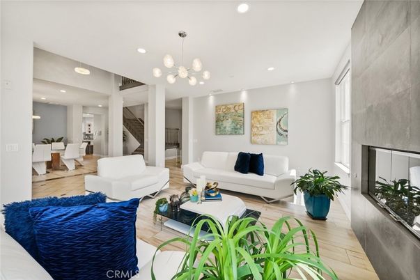 Dining room, Fireplace, Interior, Living room, Pendant Lights, Recessed Lighting, Wood Texture Flooring