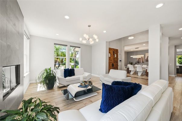 Dining room, Fireplace, Interior, Living room, Pendant Lights, Recessed Lighting, Wood Texture Flooring