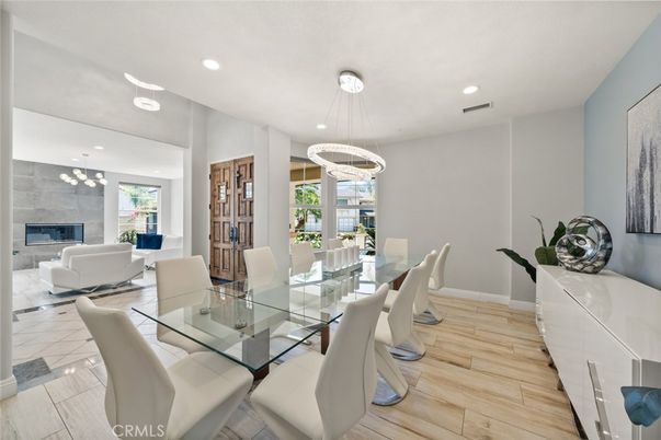 Dining room, Fireplace, Interior, Living room, Pendant Lights, Recessed Lighting, Wood Texture Flooring