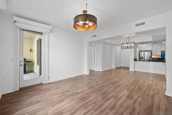 Chandelier, Empty room, Interior, Kitchen, Pendant Lights, Stainless Steel Appliances, Wood Texture Flooring