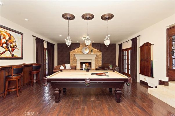 Billiard Table, Fireplace, Game Room, Interior, Pendant Lights, Recessed Lighting, Wood Texture Flooring