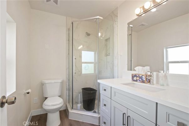 Bathroom, Glass Shower, Interior, Marble Walls, Wood Texture Flooring