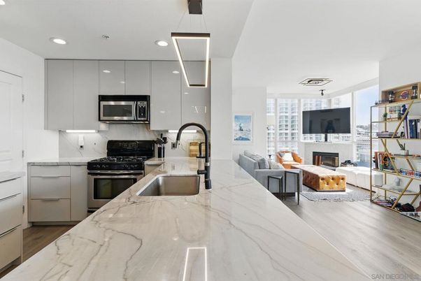Fireplace, Interior, Kitchen, Living room, Pendant Lights, Recessed Lighting, Stainless Steel Appliances, Wood Texture Flooring