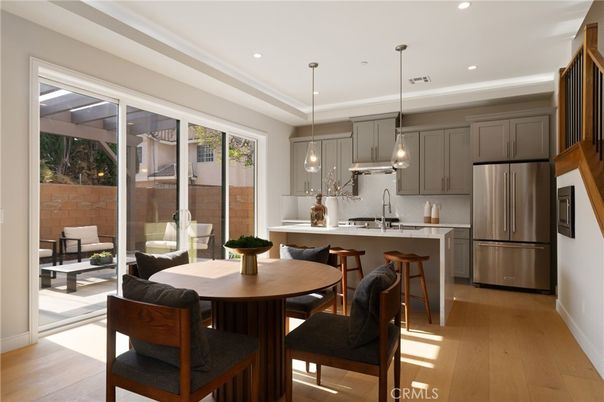 Dining room, Interior, Kitchen, Pendant Lights, Recessed Lighting, Stainless Steel Appliances, Wood Texture Flooring