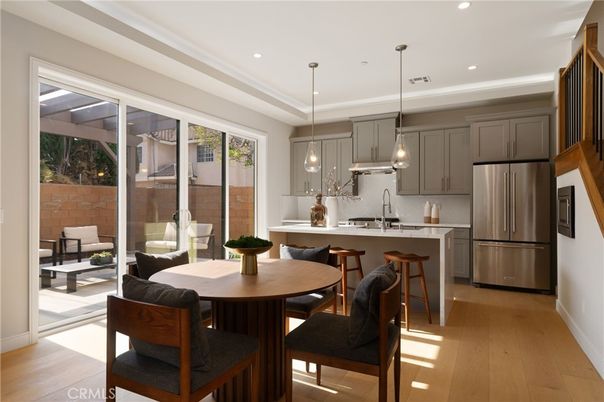 Dining room, Interior, Kitchen, Pendant Lights, Recessed Lighting, Stainless Steel Appliances, Wood Texture Flooring