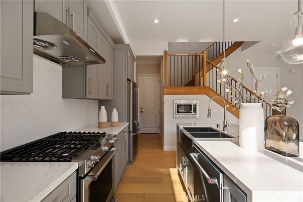 Interior, Kitchen, Pendant Lights, Recessed Lighting, Stainless Steel Appliances, Wood Texture Flooring