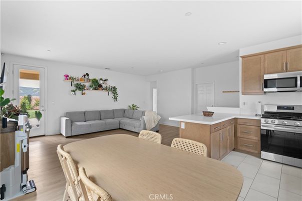 Dining room, Interior, Kitchen, Living room, Recessed Lighting, Stainless Steel Appliances, Wood Texture Flooring