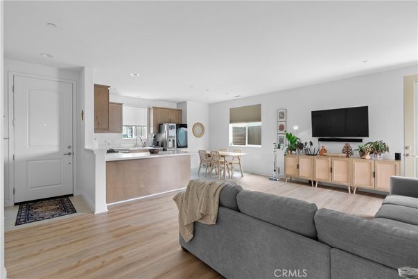 Dining room, Interior, Kitchen, Living room, Recessed Lighting, Stainless Steel Appliances, Wood Texture Flooring