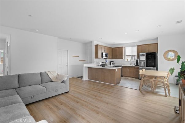Dining room, Interior, Kitchen, Living room, Recessed Lighting, Stainless Steel Appliances, Wood Texture Flooring