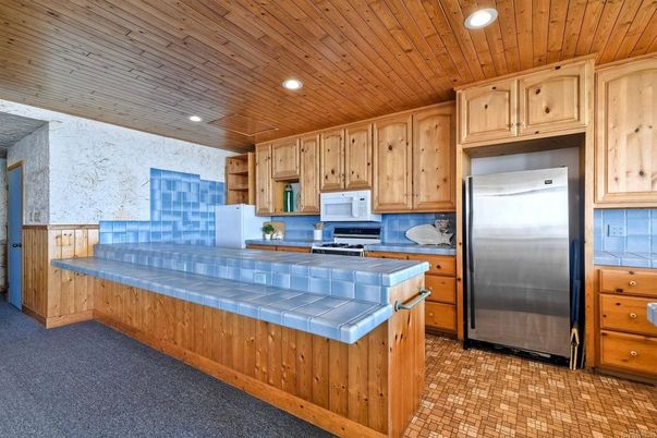 Interior, Kitchen, Recessed Lighting, Stainless Steel Appliances, Tile Countertops, Wooden Ceilings