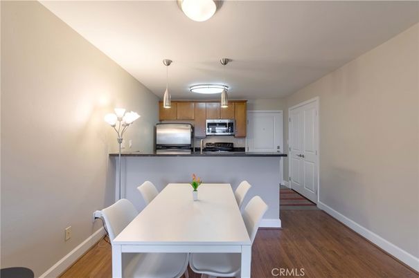 Dining room, Interior, Kitchen, Pendant Lights, Stainless Steel Appliances, Wood Texture Flooring