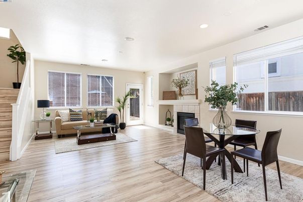 Dining room, Fireplace, Interior, Living room, Recessed Lighting, Wood Texture Flooring