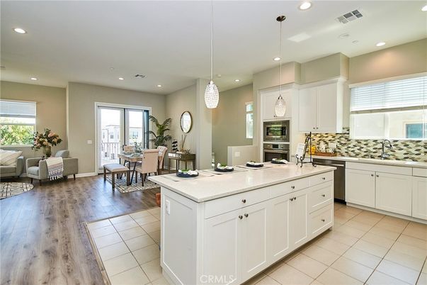 Dining room, Interior, Kitchen, Living room, Pendant Lights, Recessed Lighting, Stainless Steel Appliances, Wood Texture Flooring