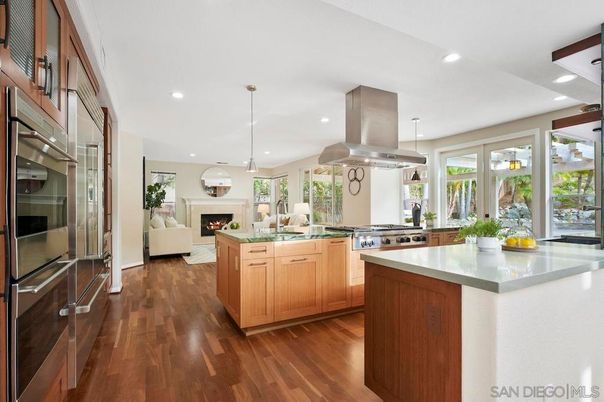 Fireplace, Interior, Kitchen, Living room, Pendant Lights, Recessed Lighting, Stainless Steel Appliances, Wood Texture Flooring