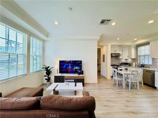 Dining room, Interior, Kitchen, Living room, Recessed Lighting, Stainless Steel Appliances, Wood Texture Flooring