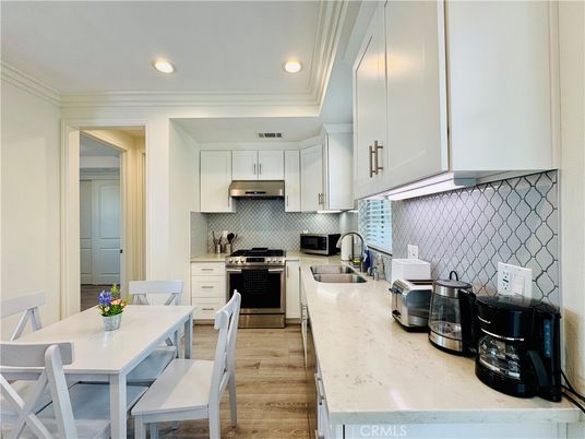 Dining room, Interior, Kitchen, Recessed Lighting, Stainless Steel Appliances, Wood Texture Flooring