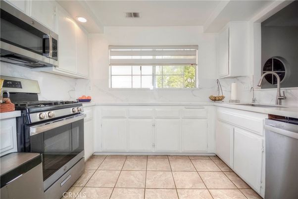 Interior, Kitchen, Marble Walls, Recessed Lighting, Stainless Steel Appliances