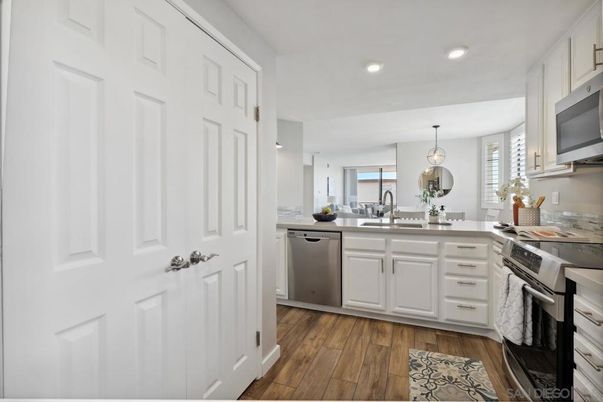 Dining room, Interior, Kitchen, Pendant Lights, Recessed Lighting, Stainless Steel Appliances, Wood Texture Flooring