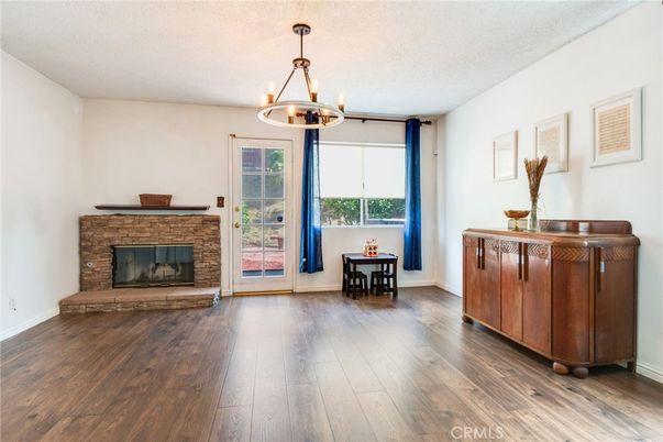Chandelier, Dining room, Fireplace, Interior, Pendant Lights, Wood Texture Flooring