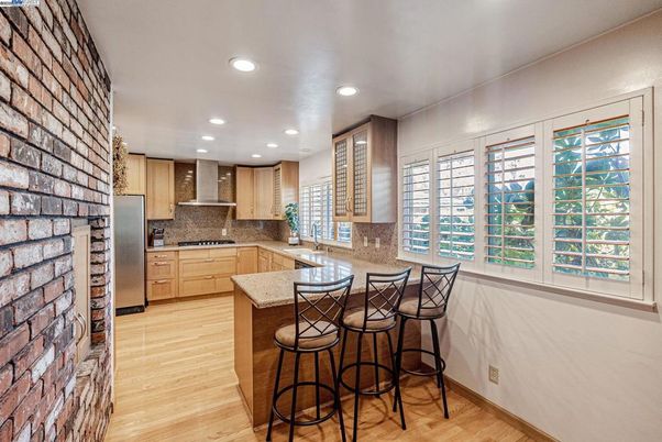 Interior, Kitchen, Recessed Lighting, Stainless Steel Appliances, Stone Walls, Wood Texture Flooring