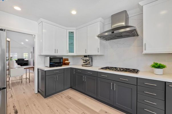 Dining room, Interior, Kitchen, Marble Walls, Recessed Lighting, Stainless Steel Appliances, Wood Texture Flooring