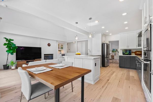 Dining room, Fireplace, Interior, Kitchen, Living room, Pendant Lights, Recessed Lighting, Stainless Steel Appliances, Wood Texture Flooring