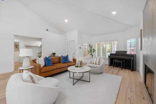 Fireplace, Interior, Living room, Piano, Recessed Lighting, Wood Texture Flooring