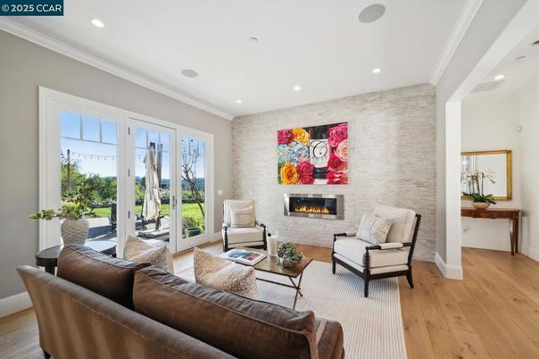 Fireplace, Interior, Living room, Recessed Lighting, Stone Walls, Wood Texture Flooring