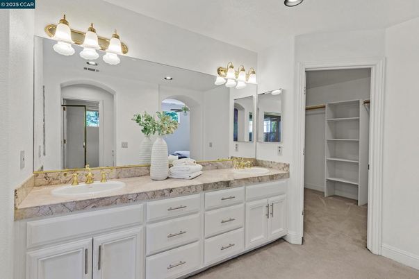 Bathroom, Dual Sink Vanities, Interior, Recessed Lighting, Tile Countertops, Walk-in Closets